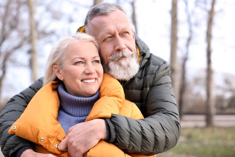 senior couple enjoying outside with their Custom Hair pieces